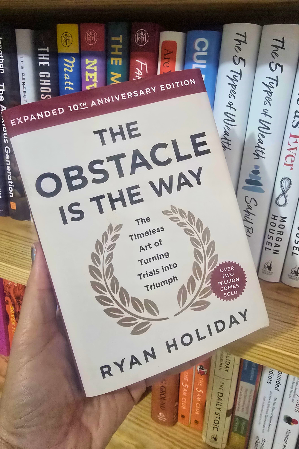 Front cover of The Obstacle Is the Way by Ryan Holiday, a philosophy book available in Trinidad.