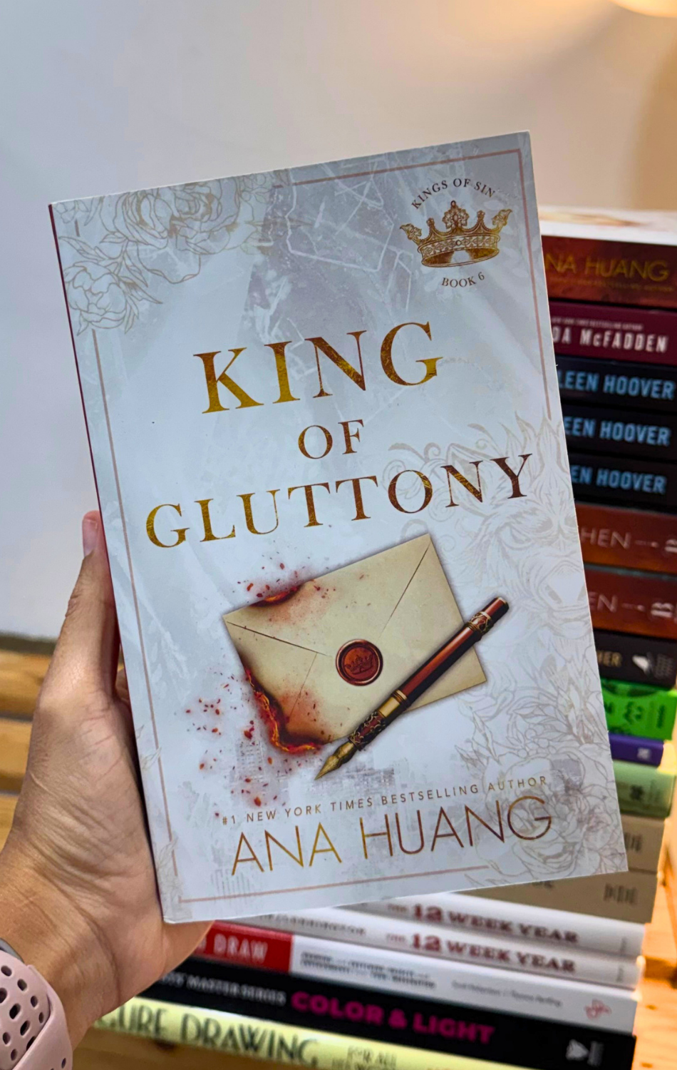 Cover of King of Gluttony by Ana Huang, a book about rivals-to-lovers romance, ambition, tension, and childhood rivalry available in Trinidad.