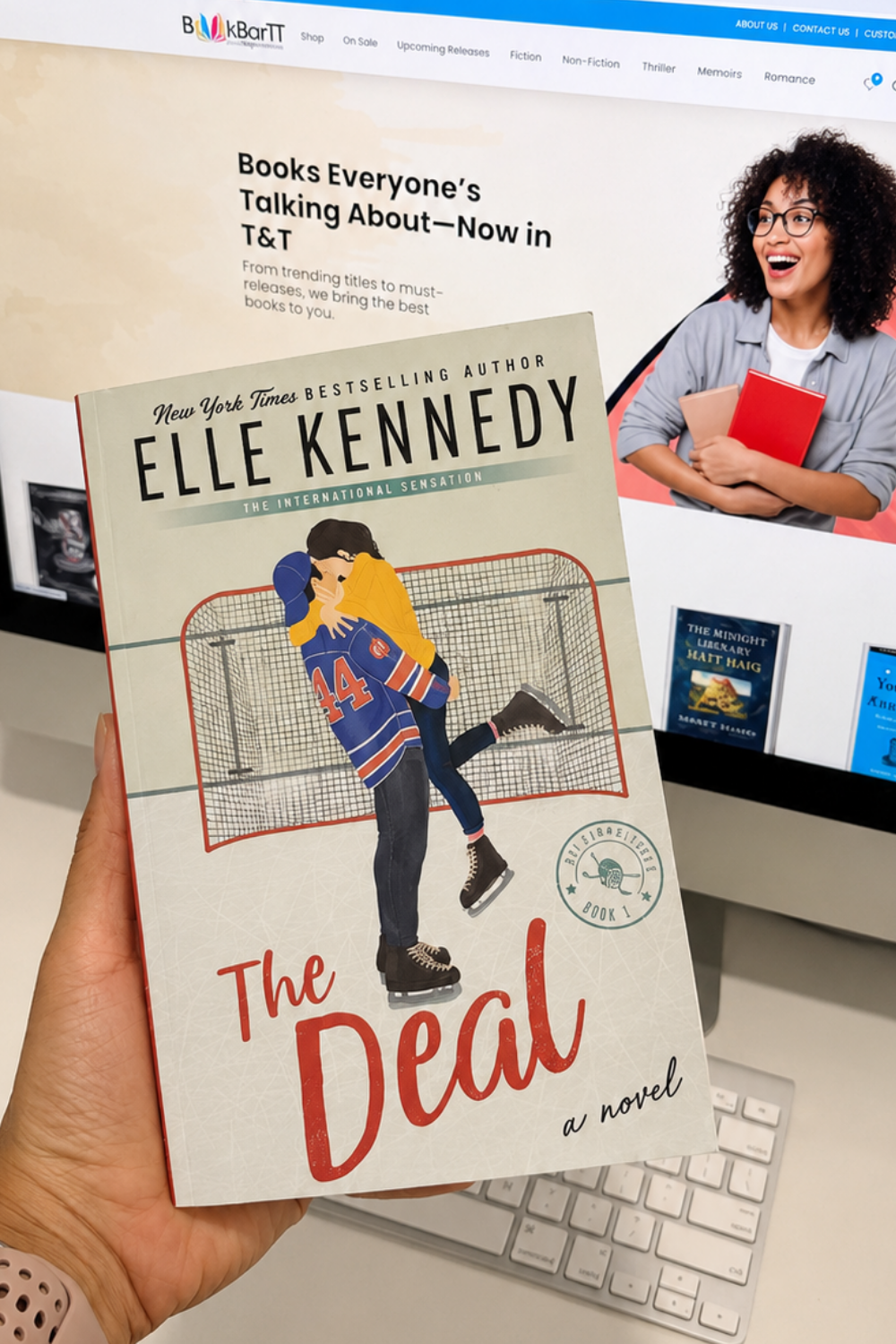 Cover of The Deal by Elle Kennedy, a romance book about fake dating, college hockey, and unexpected love available in Trinidad.